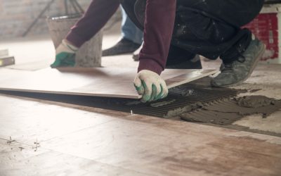 Laying floor ceramic tile. Renovating the floor